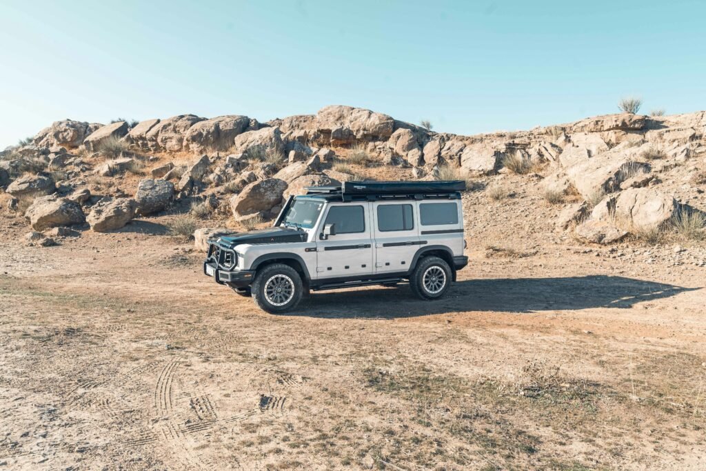 7 Ultimate Tadoba Safari Experience Highlights for an Unforgettable trip A rugged 4x4 vehicle ready for off-roading in the rocky desert of Erbil, Iraq under a clear blue sky.